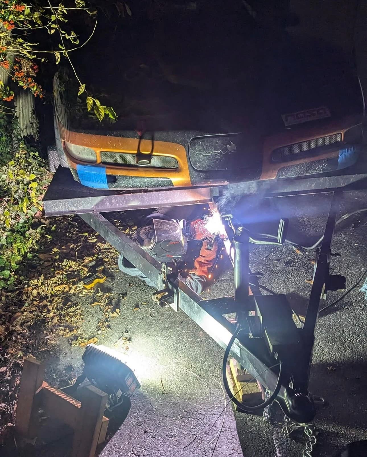 Late-night welding on a trailer frame