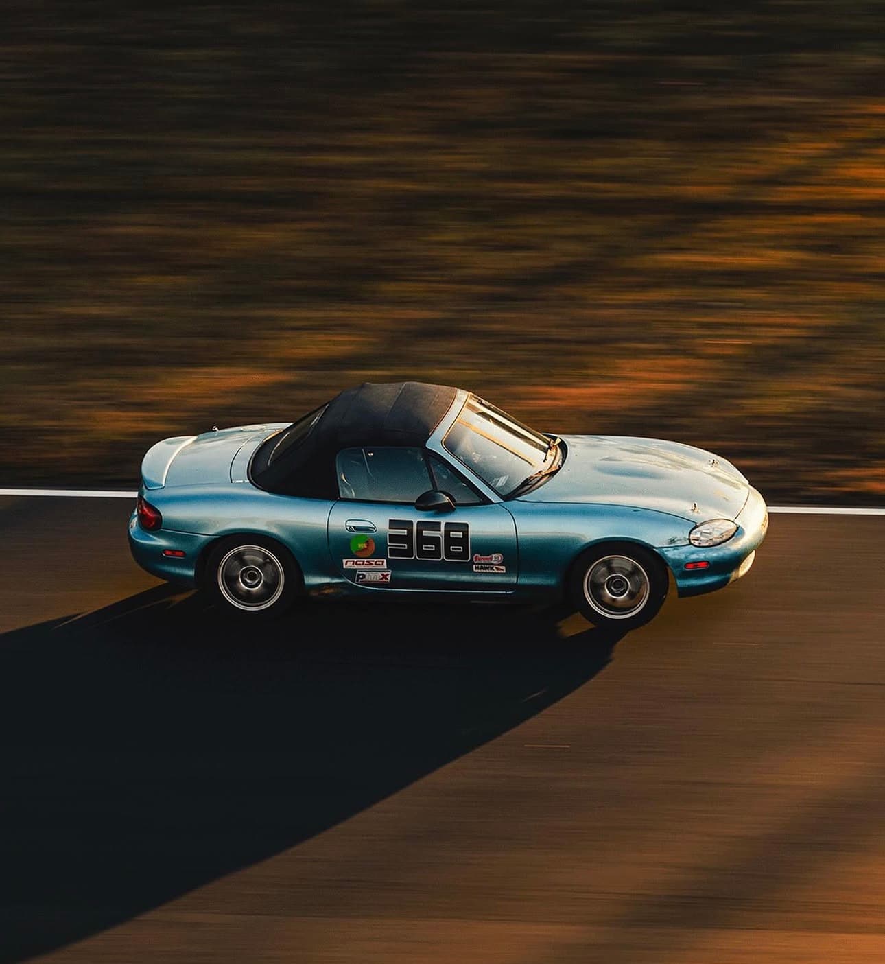 Taylor's race car cornering at high speed on track